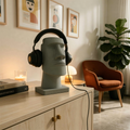 Easter Island Moai head headphone stand on a styled desk